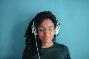 black woman listening to music