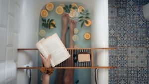 person reading in the bathtub
