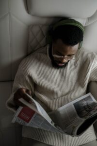 black man reading newspaper
