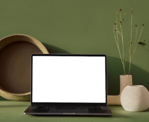 open laptop with green background